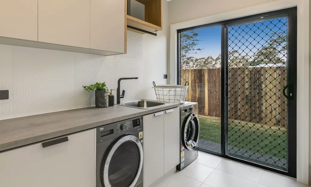 Diamond grille security screen door on an aluminium sliding door in a laundry